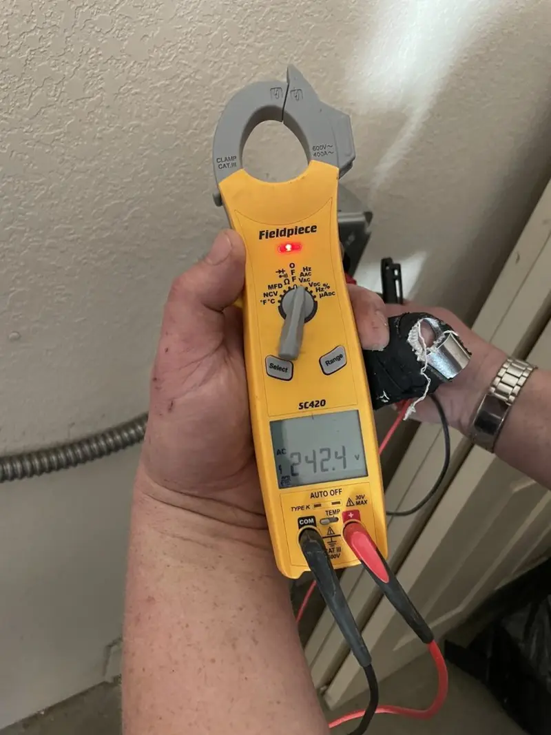 Voltage testing with clamp meter during Electrical Installation Services in South Apopka